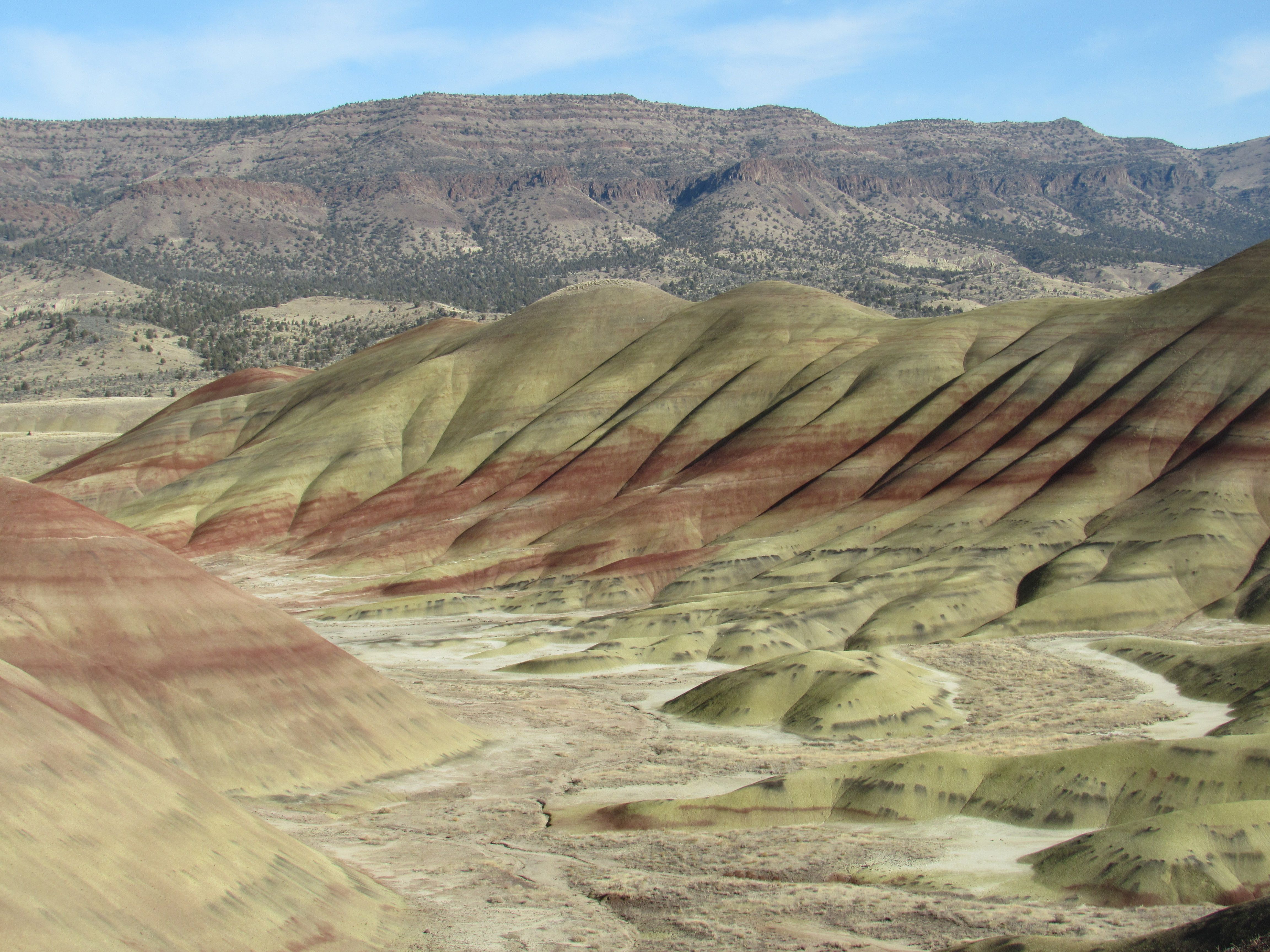 Explore the vibrant colors of the Painted Hills at John Day Fossil Beds in Oregon, USA.