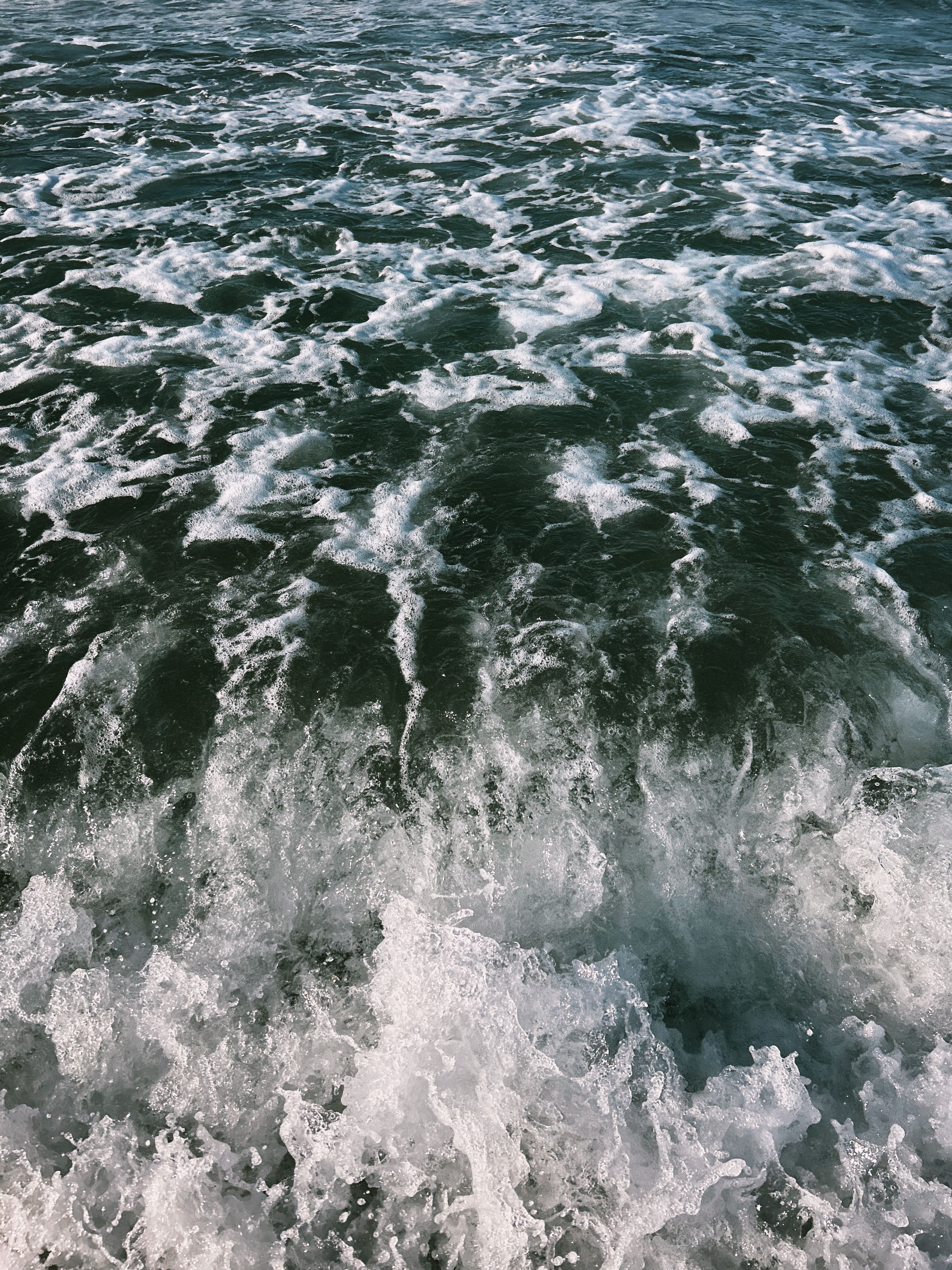 Vibrant ocean waves crashing, capturing the energy and fluidity of the sea.