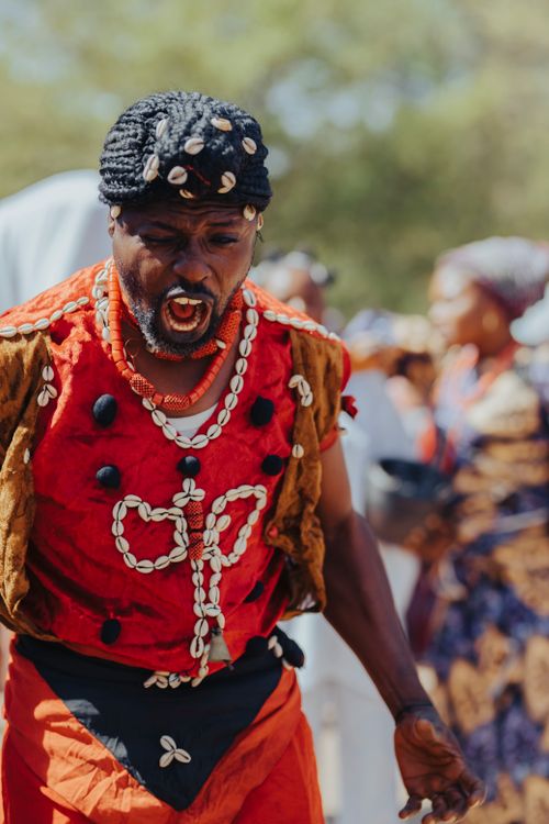 Free A vibrant image of a traditional African dance ceremony outdoors in colorful attire. Stock Photo