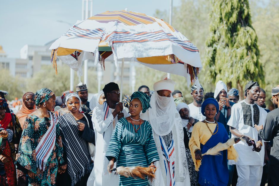 A lively Nigerian wedding ceremony with traditional attire and cultural elements.