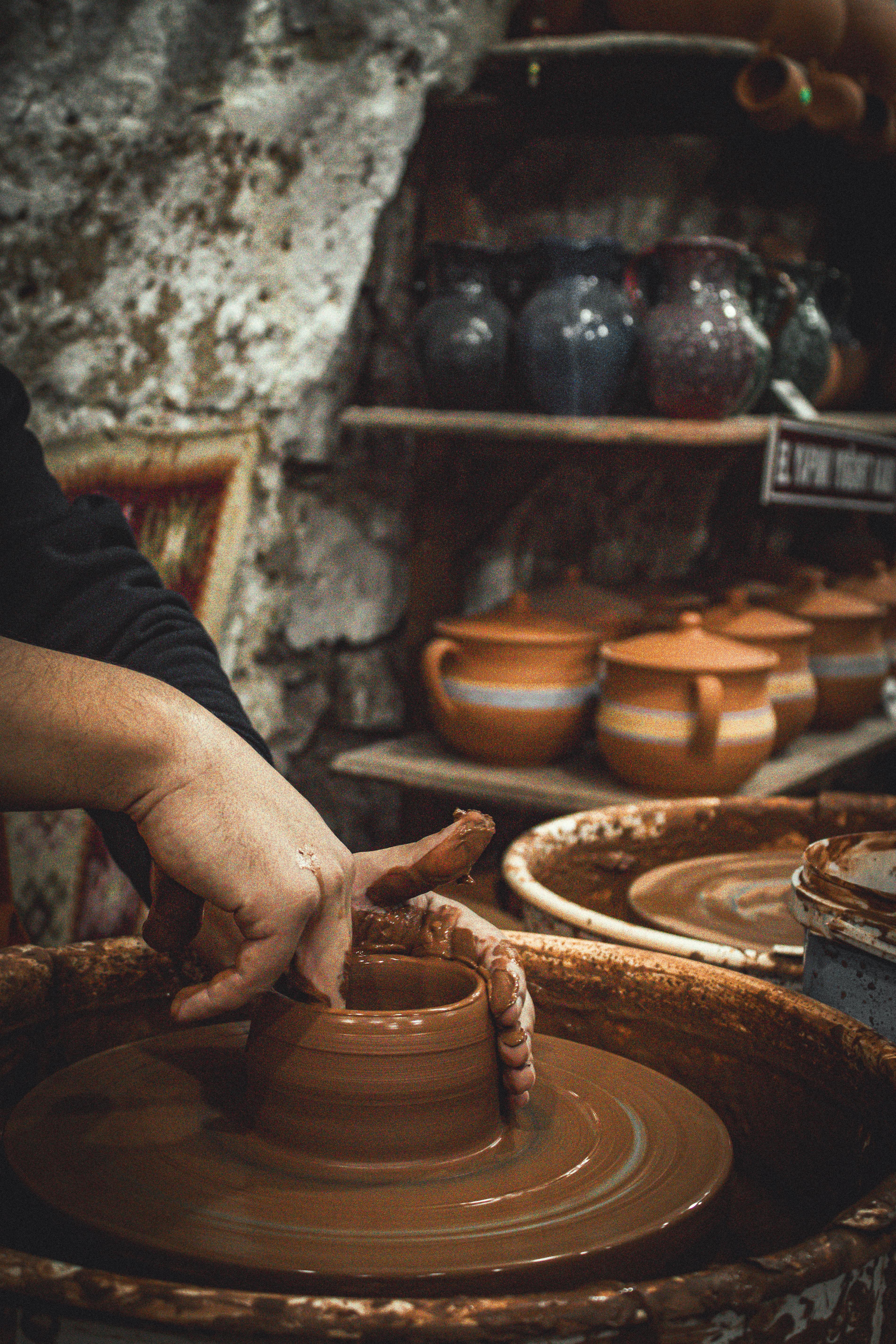Workshop setting — artisan crafting on traditional wheel