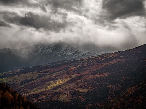 Free Stunning view of mountains under stormy sky in Domleschg, Switzerland. Stock Photo