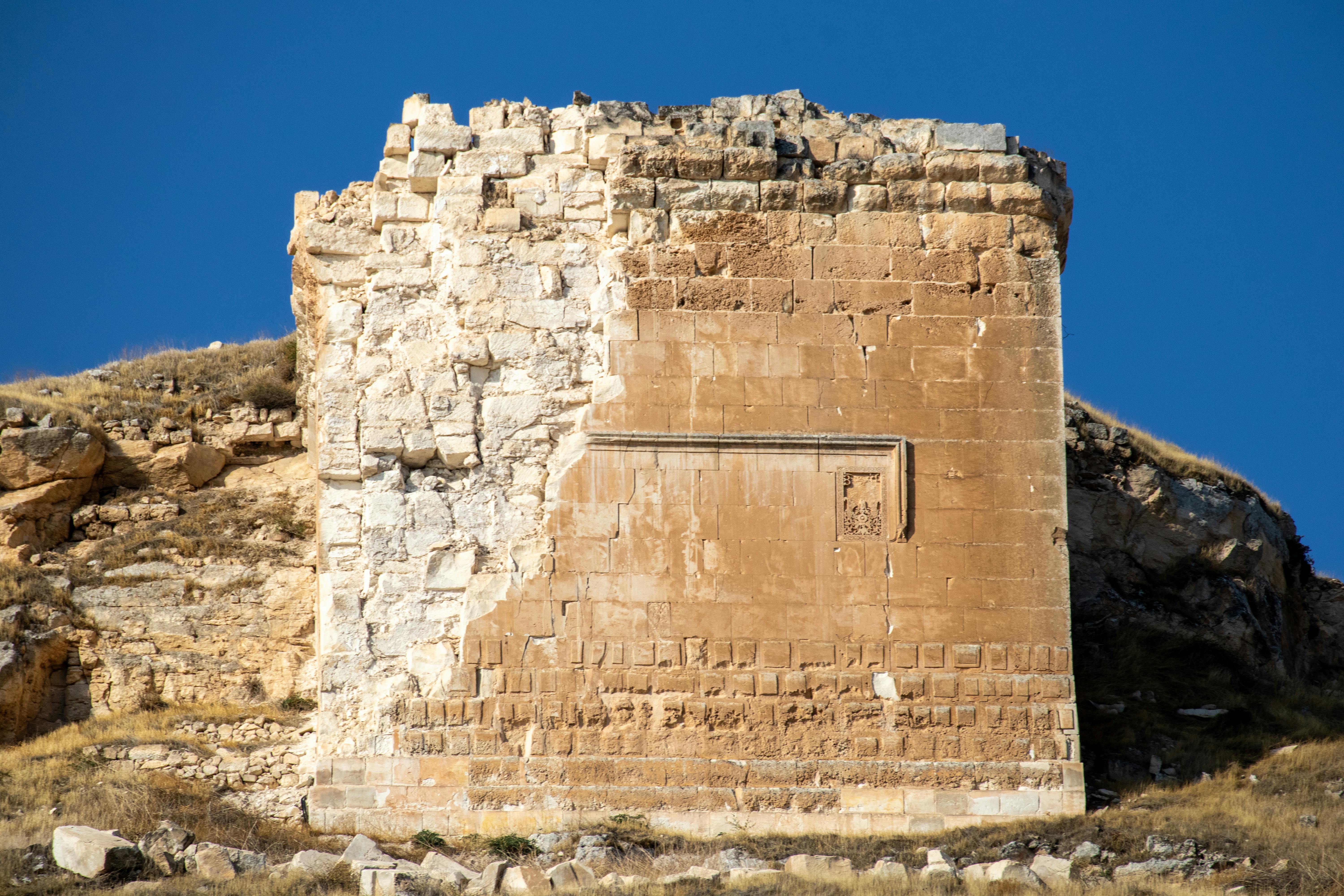Explore ancient Roman ruins in Gaziantep, Türkiye, capturing historic architecture against a vivid blue sky.