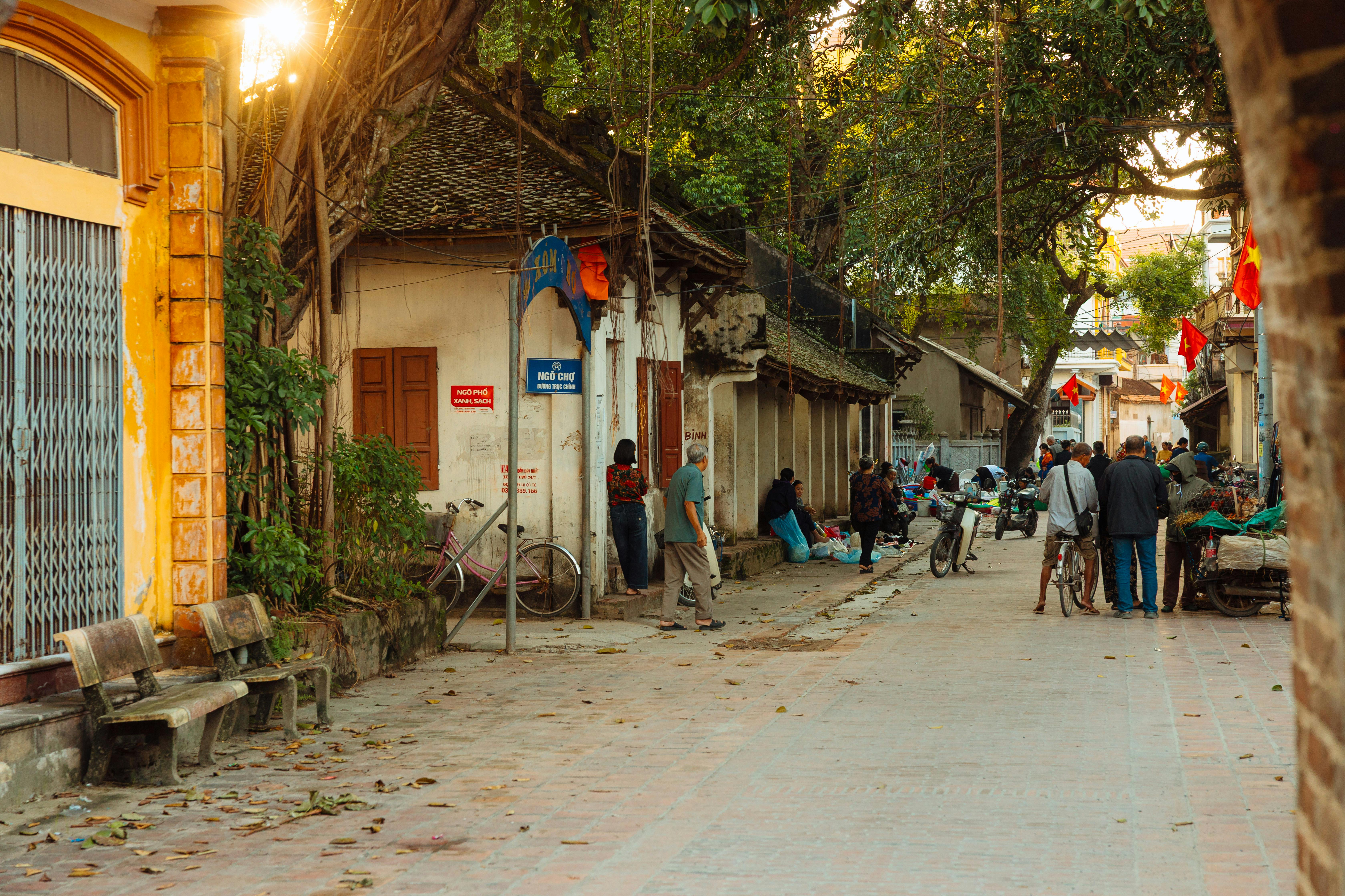 Vibrant Vietnamese street scene showcasing daily life and traditional architecture.
