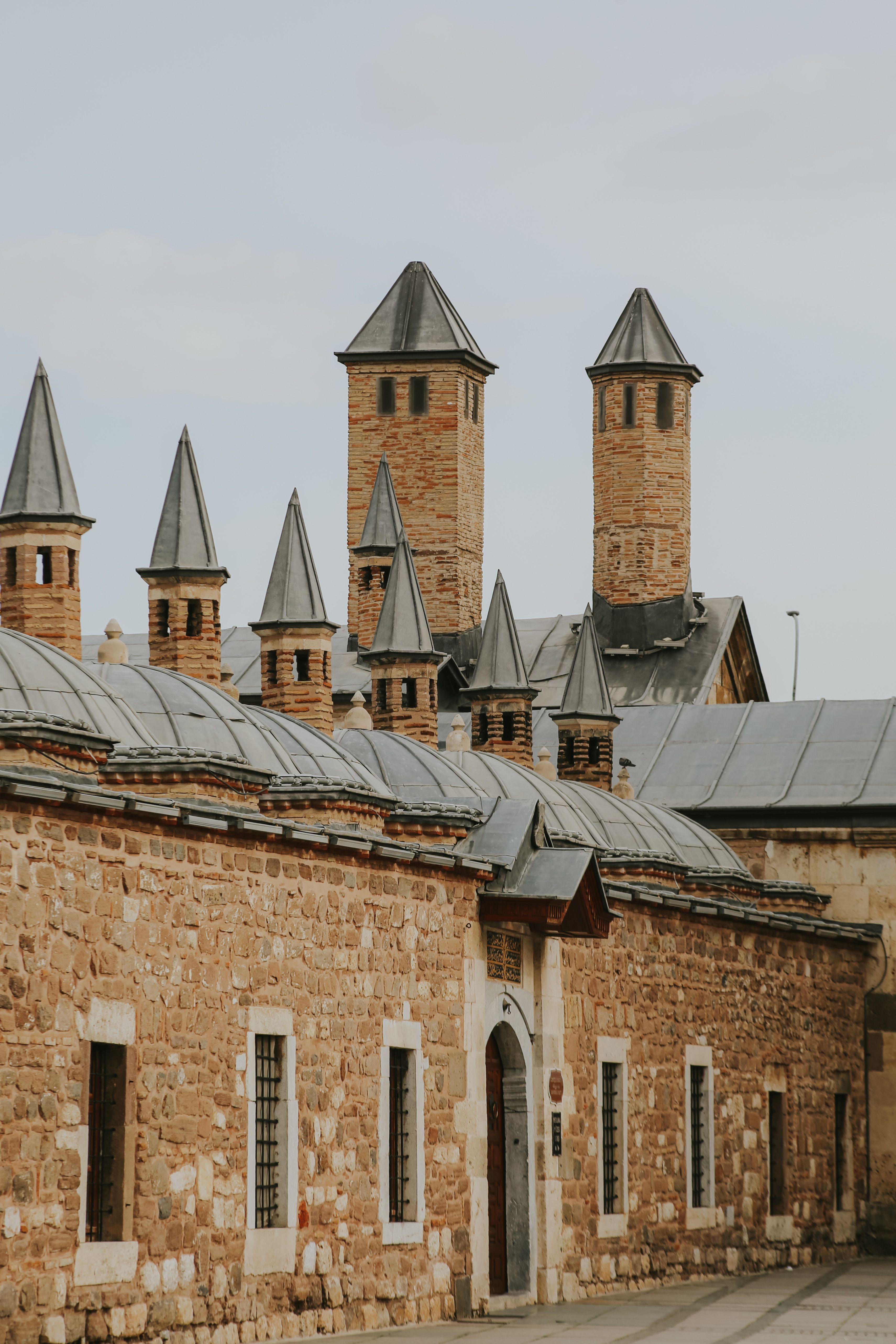 Historic Stone Building with Conical Towers · Free Stock Photo