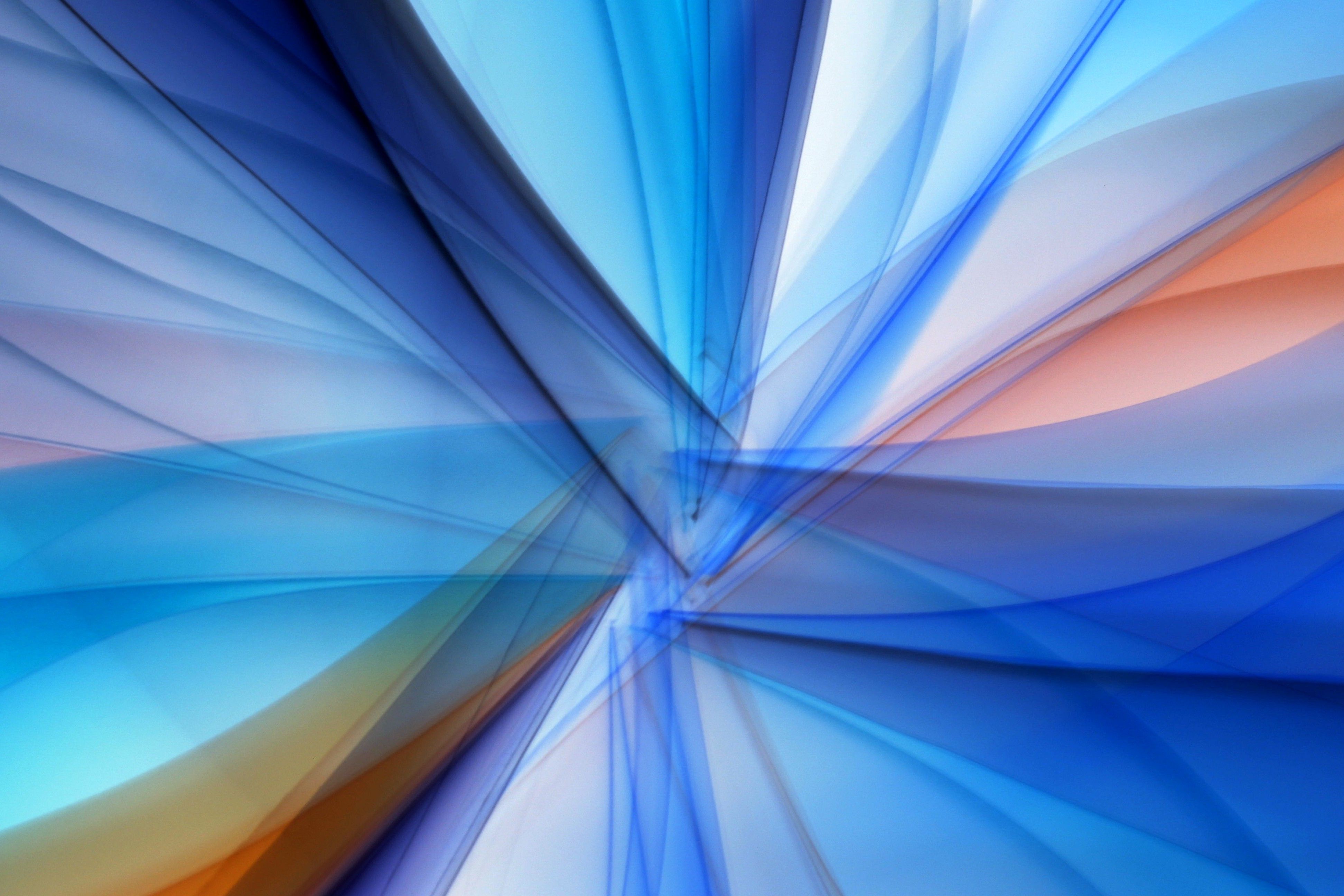 Vibrant abstract design featuring dynamic blue and orange lines in motion.