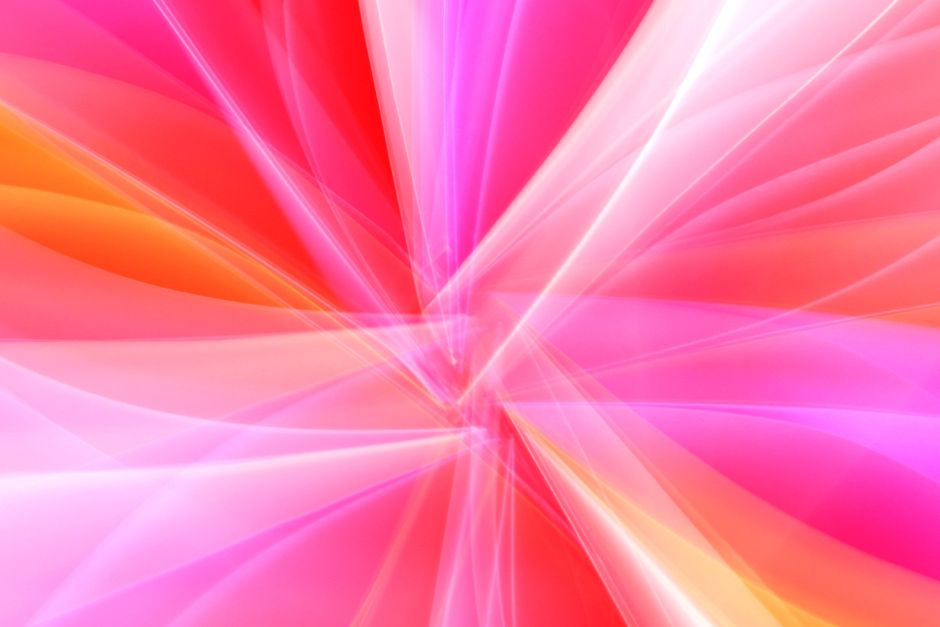 Dynamic abstract image featuring vibrant pink and orange light streaks creating a mesmerizing pattern.