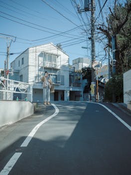 Serene scene of a quiet residential street in Shibuya, Tokyo, on a clear day.