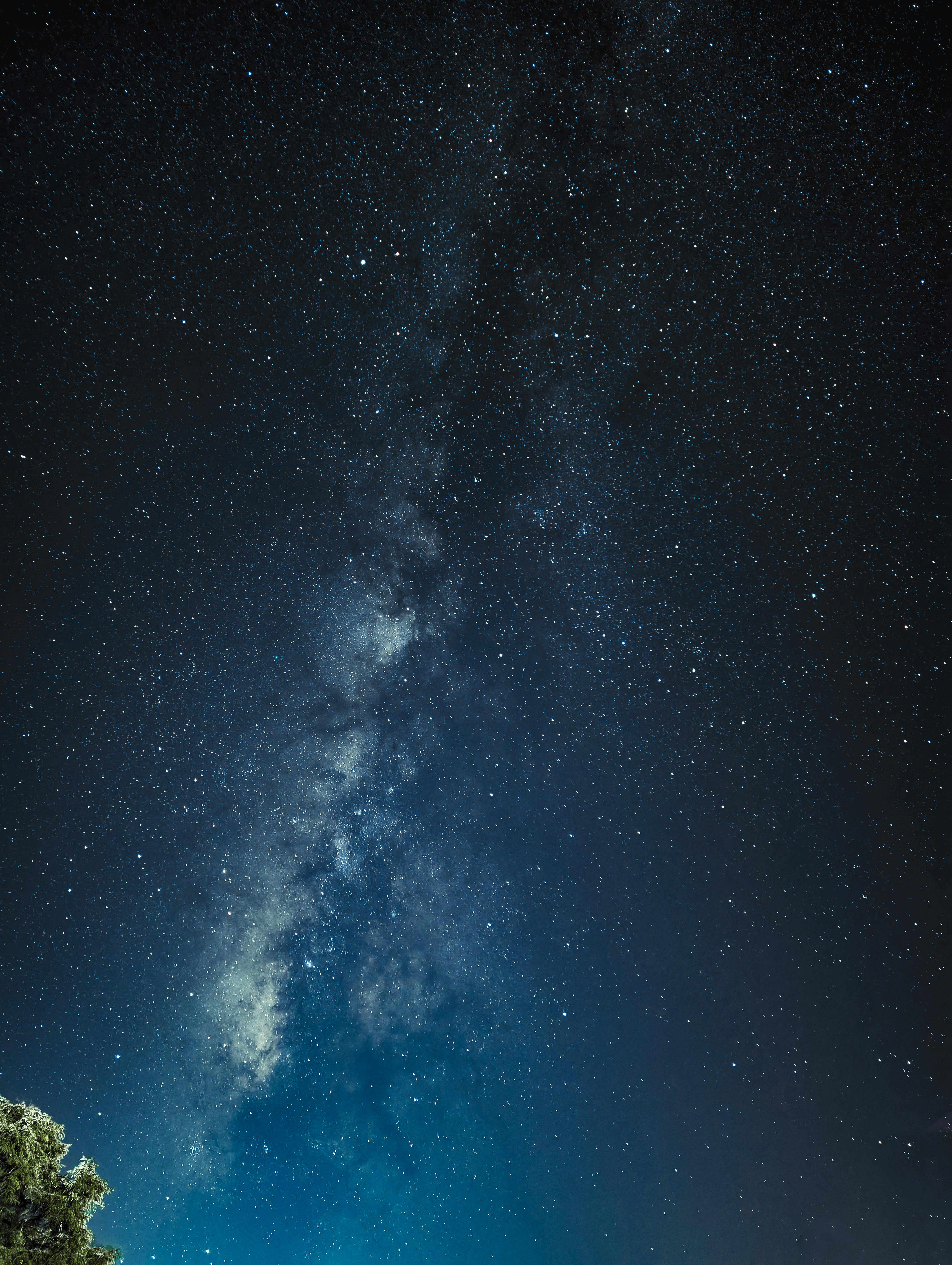 A breathtaking view of the Milky Way galaxy shining brightly in the night sky over Nepal's Himalayas.
