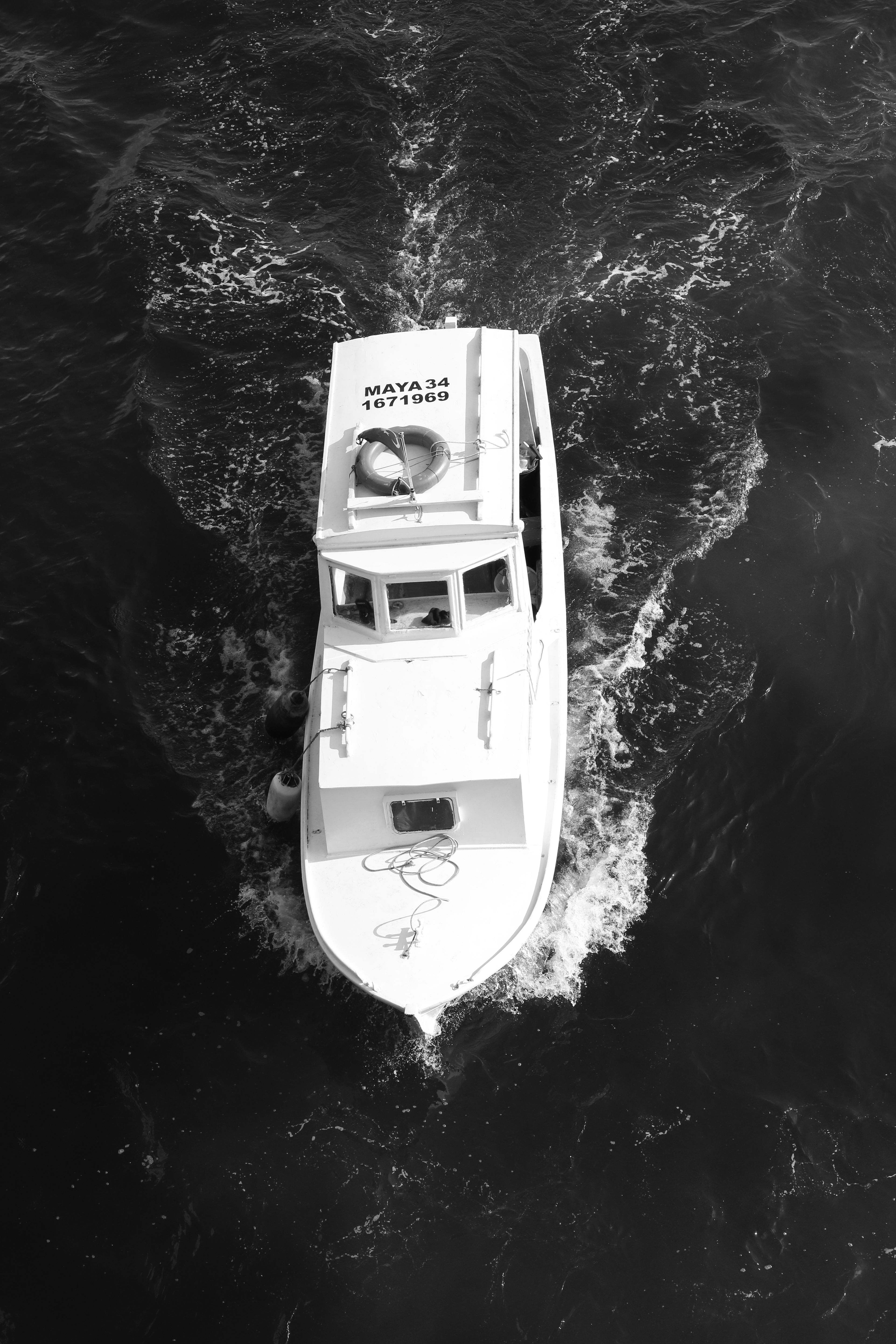 Aerial View of White Boat on Ocean Surface · Free Stock Photo