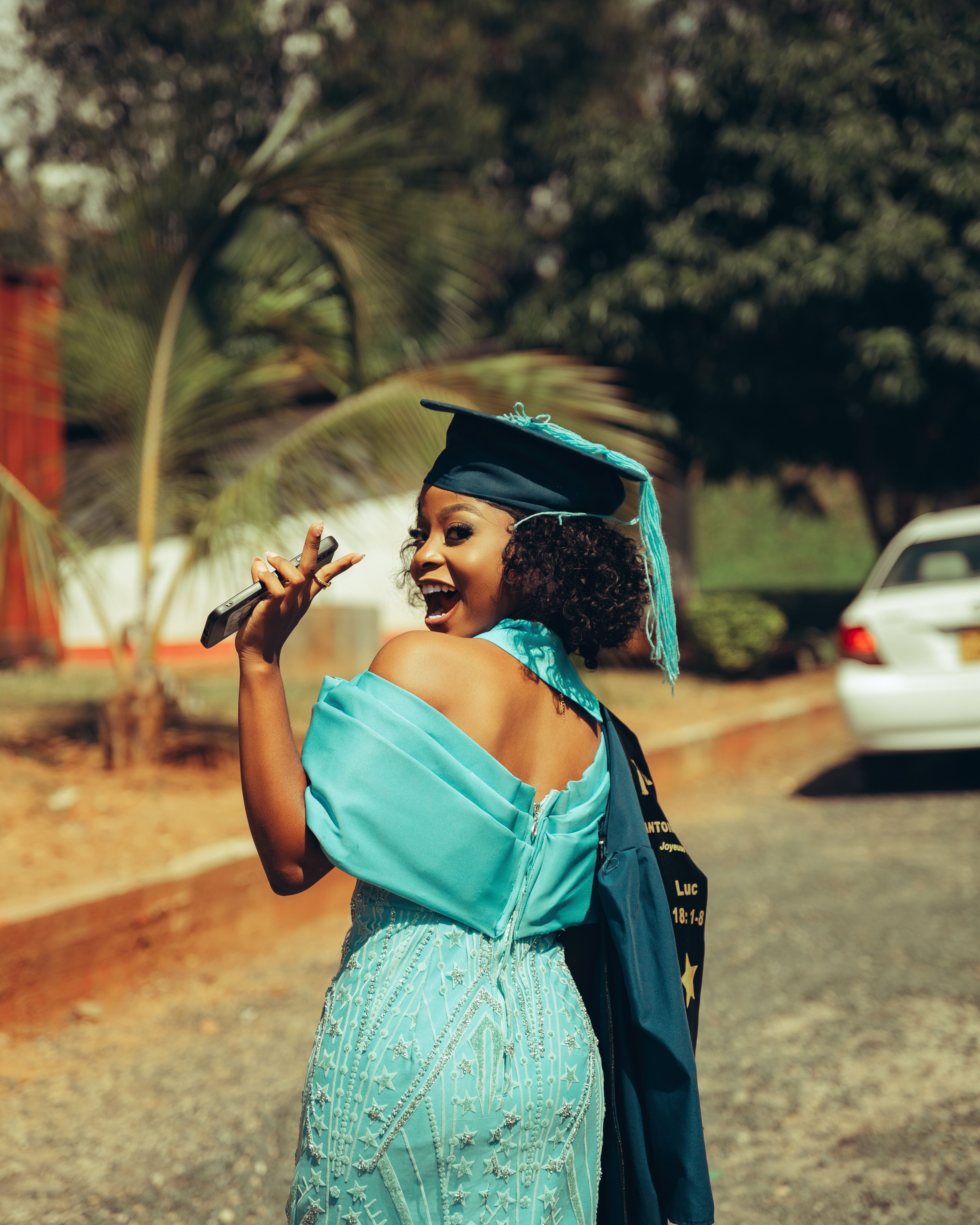 Graduation Day Outdoors with Cap and Gown  Free Stock Photo