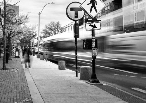 Free Blurred motion of a city street in Somerville with pedestrians and traffic. Stock Photo