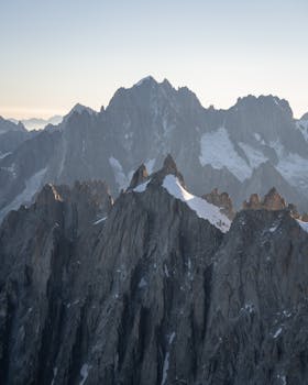 Breathtaking view of the rugged peaks in Chamonix, France, captured at sunrise.
