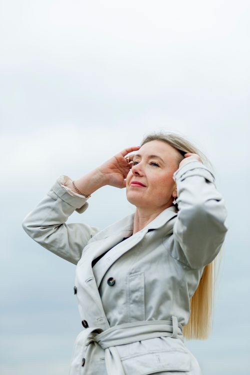 Free A confident woman enjoying the breeze outdoors in Lviv, Ukraine. Stock Photo