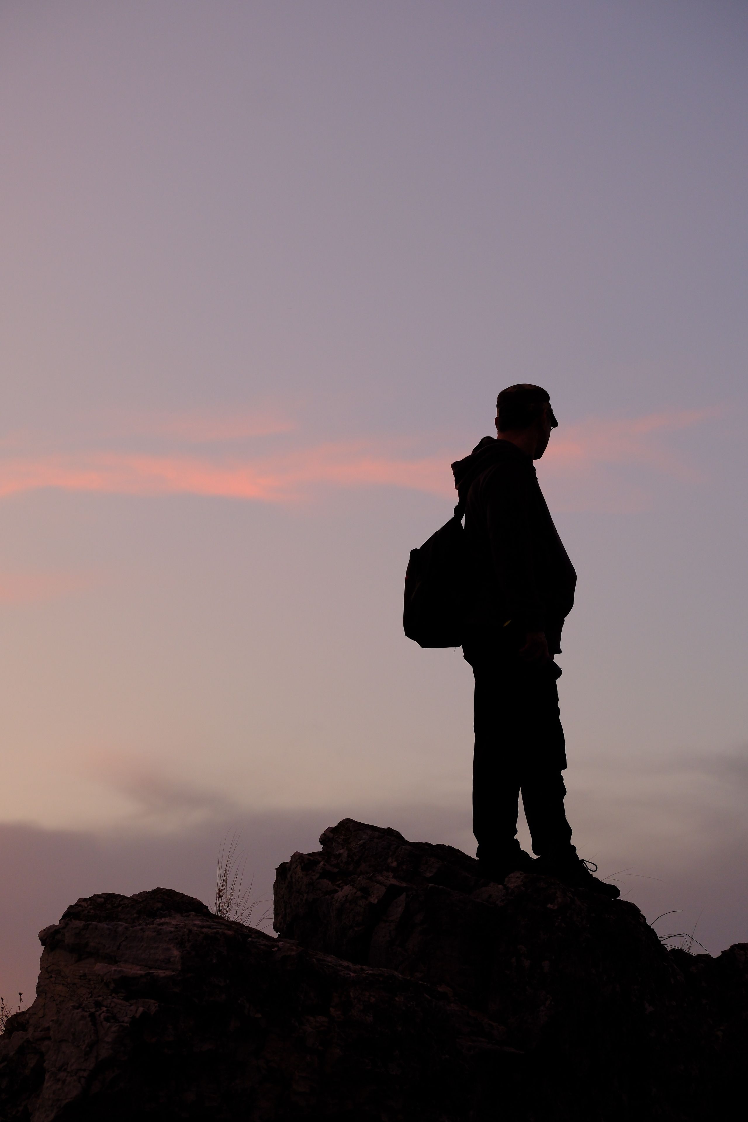 Silhouette of Person Hiking at Sunset · Free Stock Photo