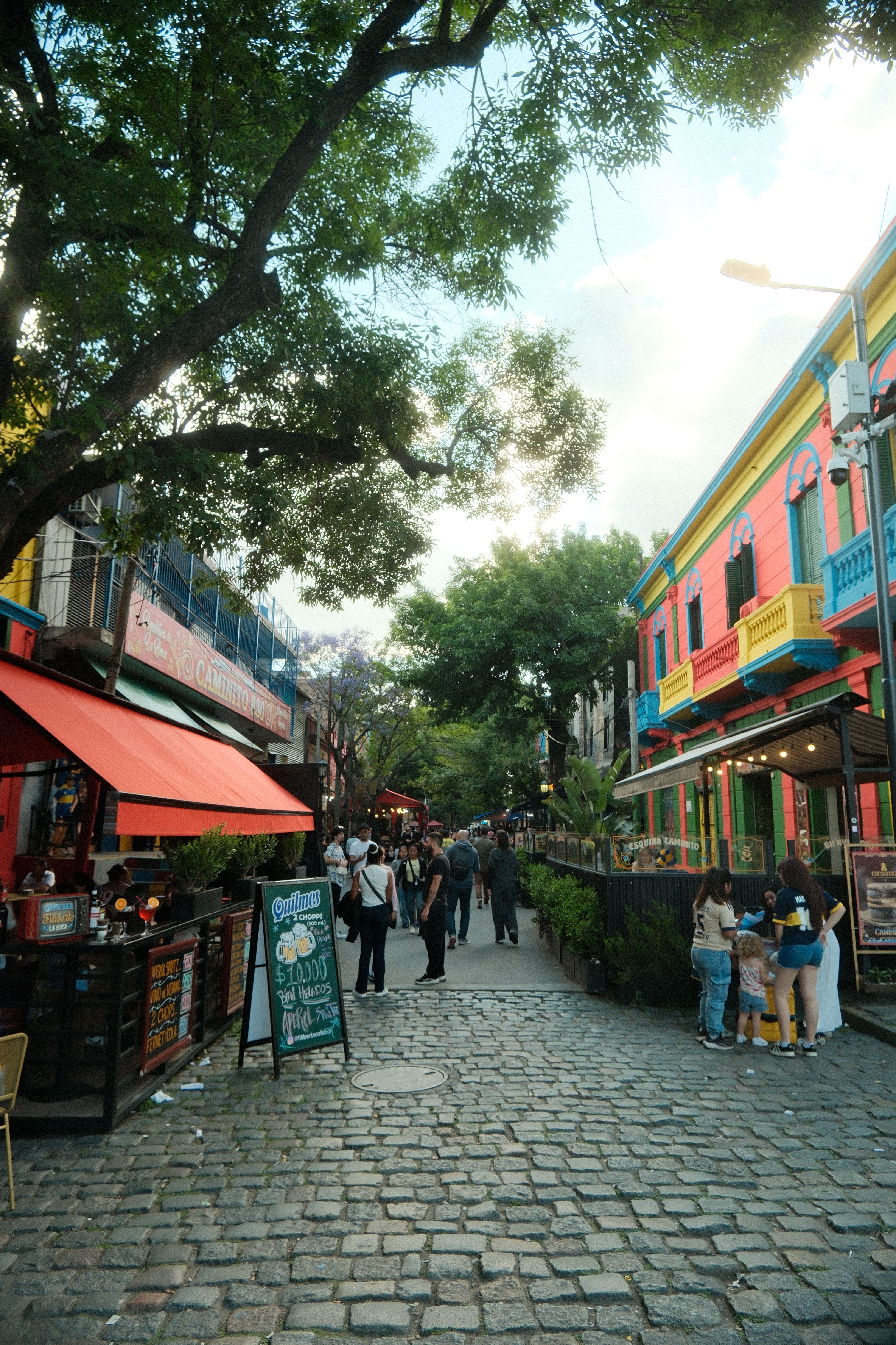Vibrant street scene in La Boca, Buenos Aires, capturing colorful buildings and lively atmosphere.