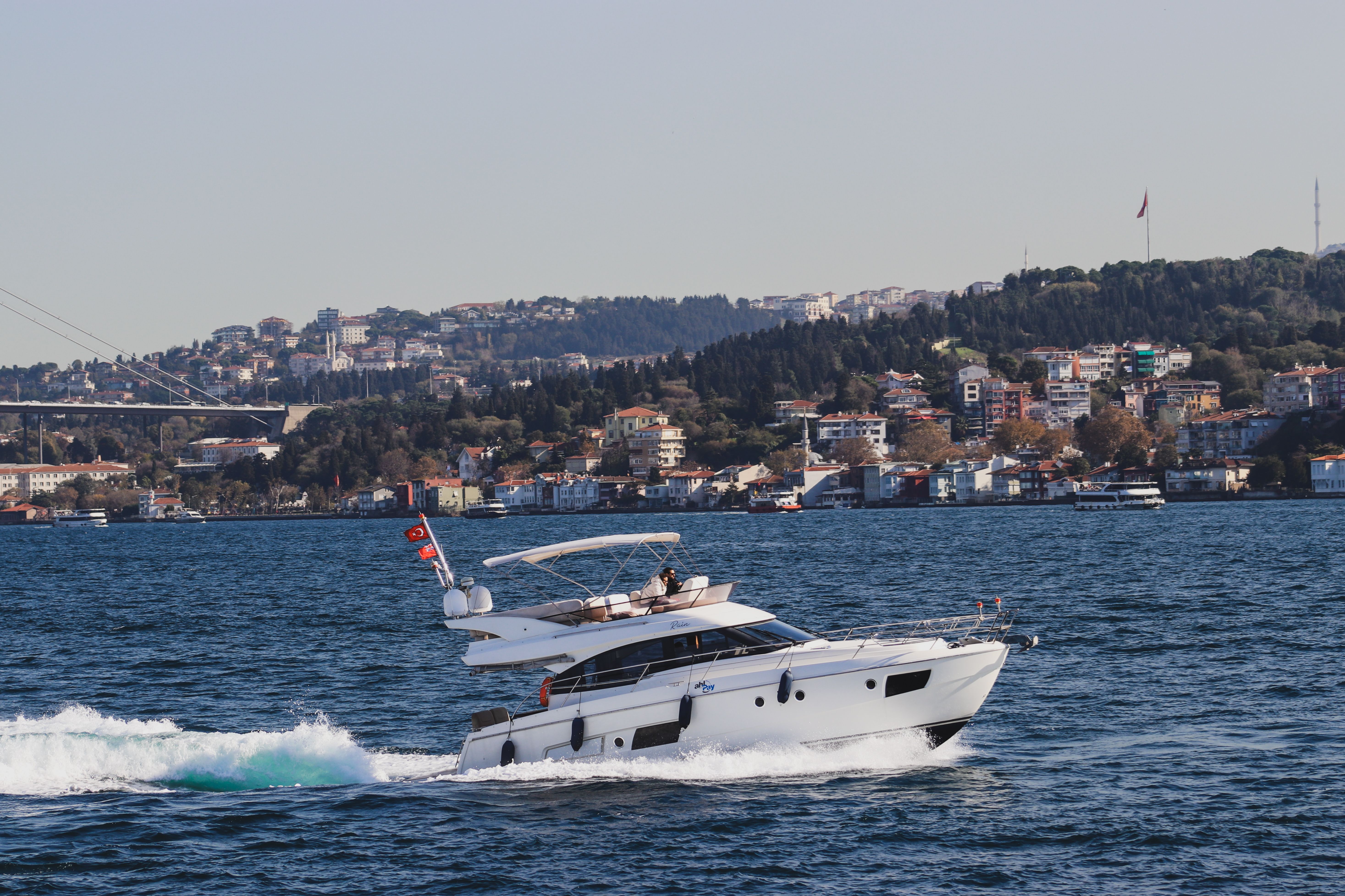 Luxury Yacht on Bosphorus with Istanbul Skyline · Free Stock Photo