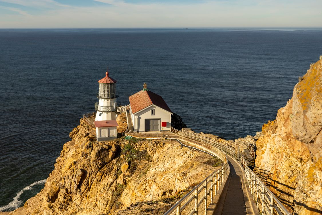 Perched Lighthouse Dramatic Coastal Lighthouse on Rugged Cliff · Free Stock Photo