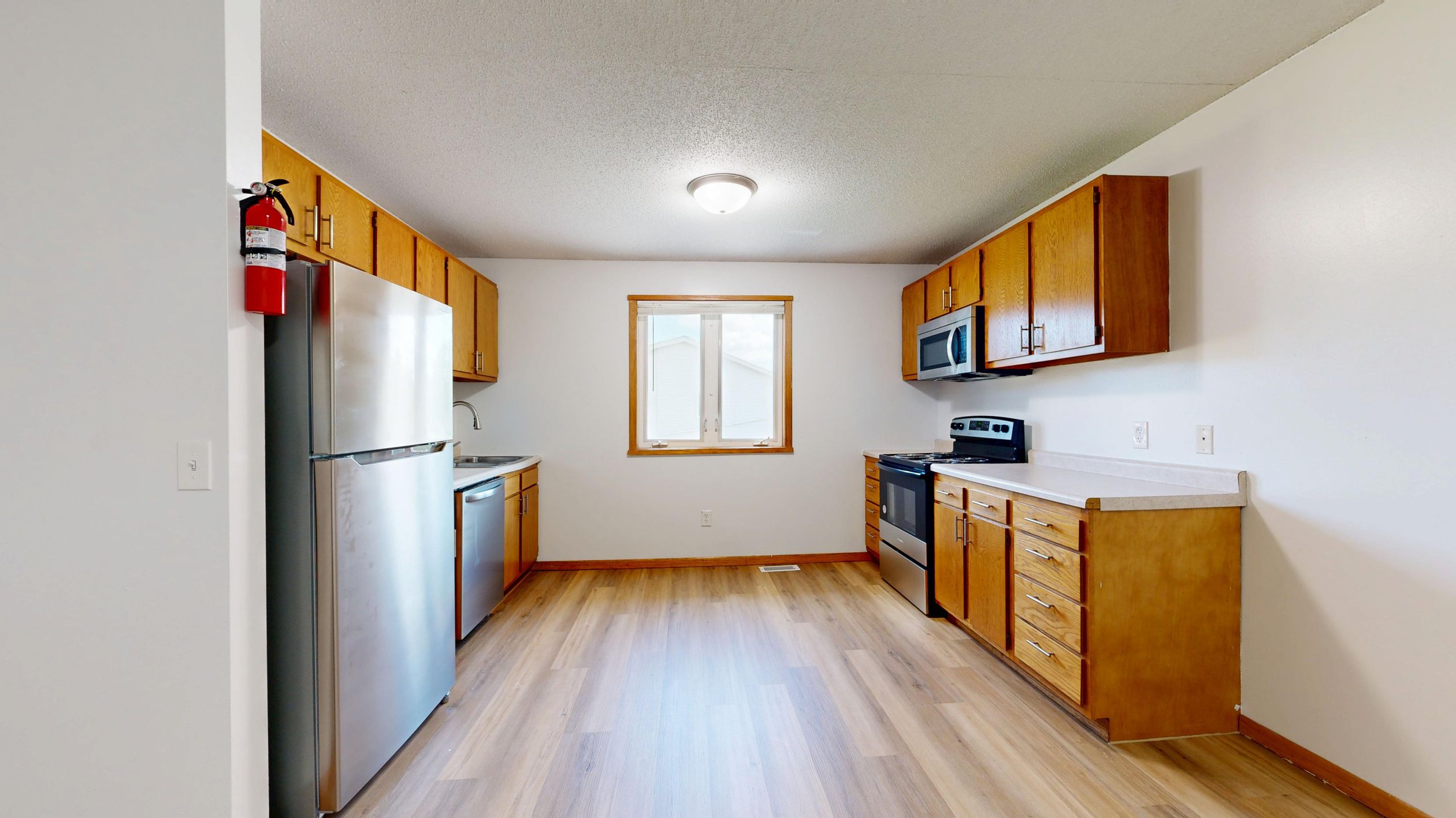 Modern Kitchen Interior with Wooden Cabinets · Free Stock Photo