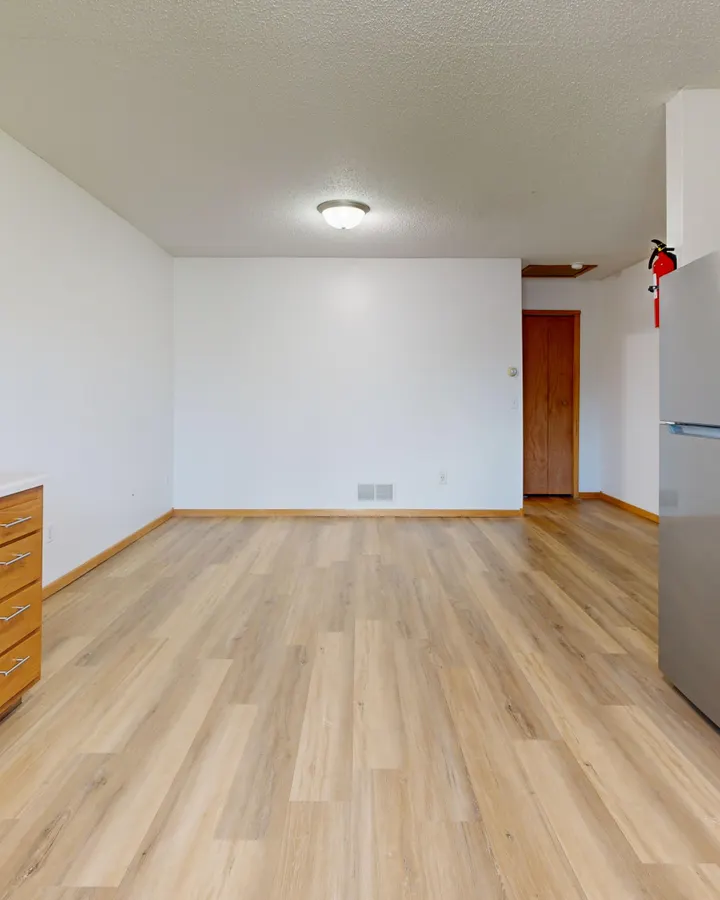 Refrigerator brands we repair in La Mesa, CA Spacious modern kitchen with hardwood floors, wooden cabinets and a refrigerator in La Mesa