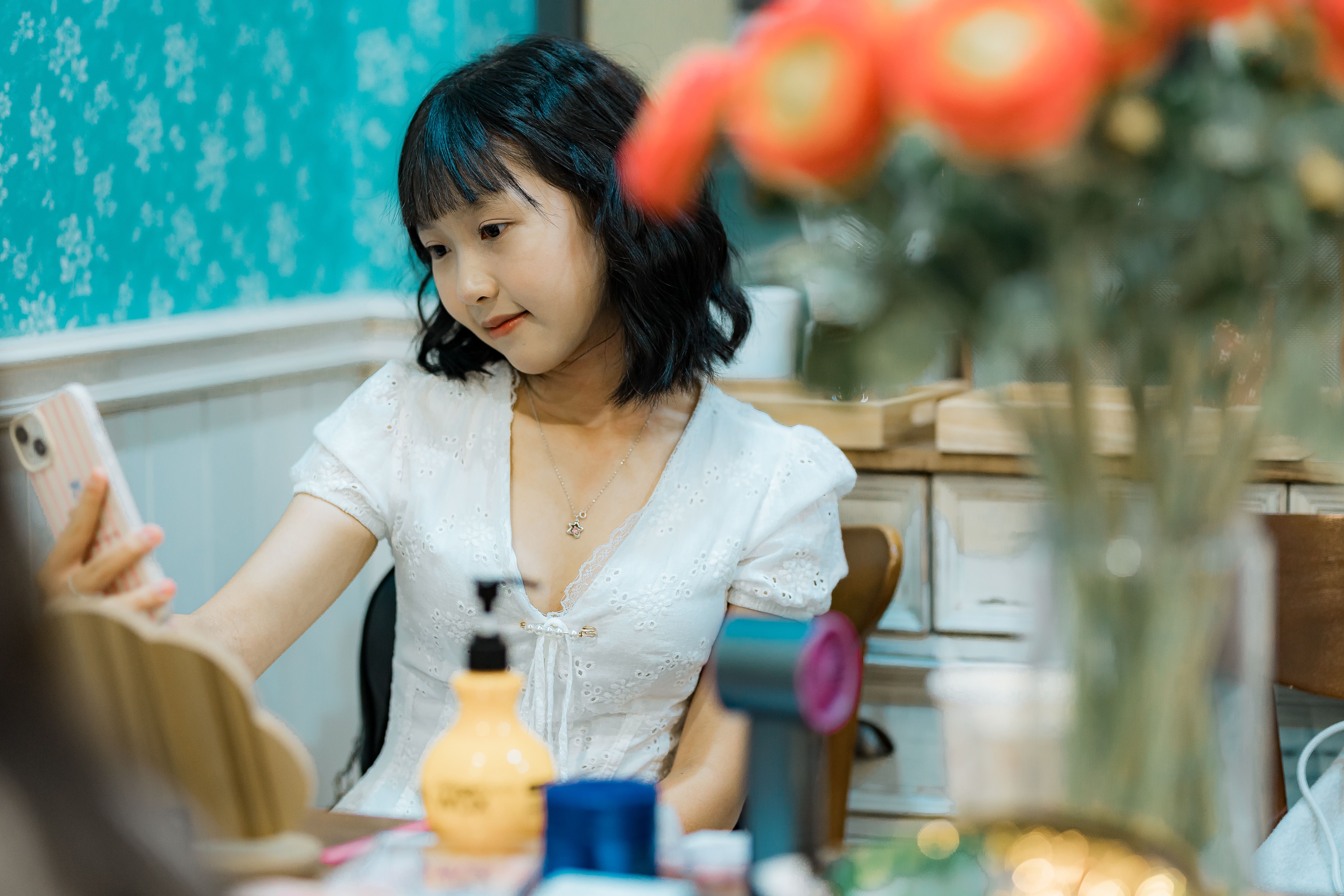 Young Woman Taking a Selfie in Cozy Room · Free Stock Photo