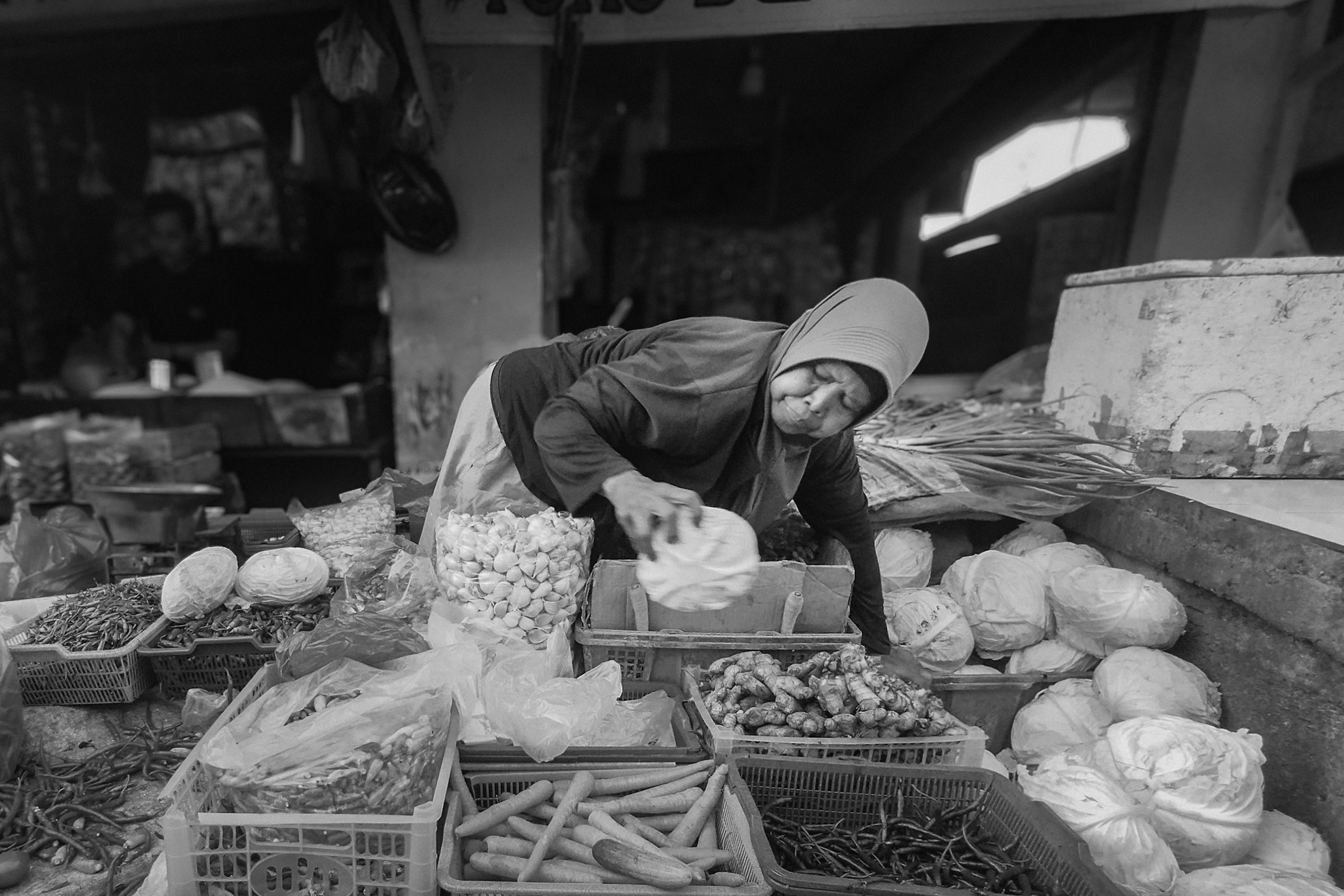Elderly Woman Selling Fresh Produce at Market · Free Stock Photo