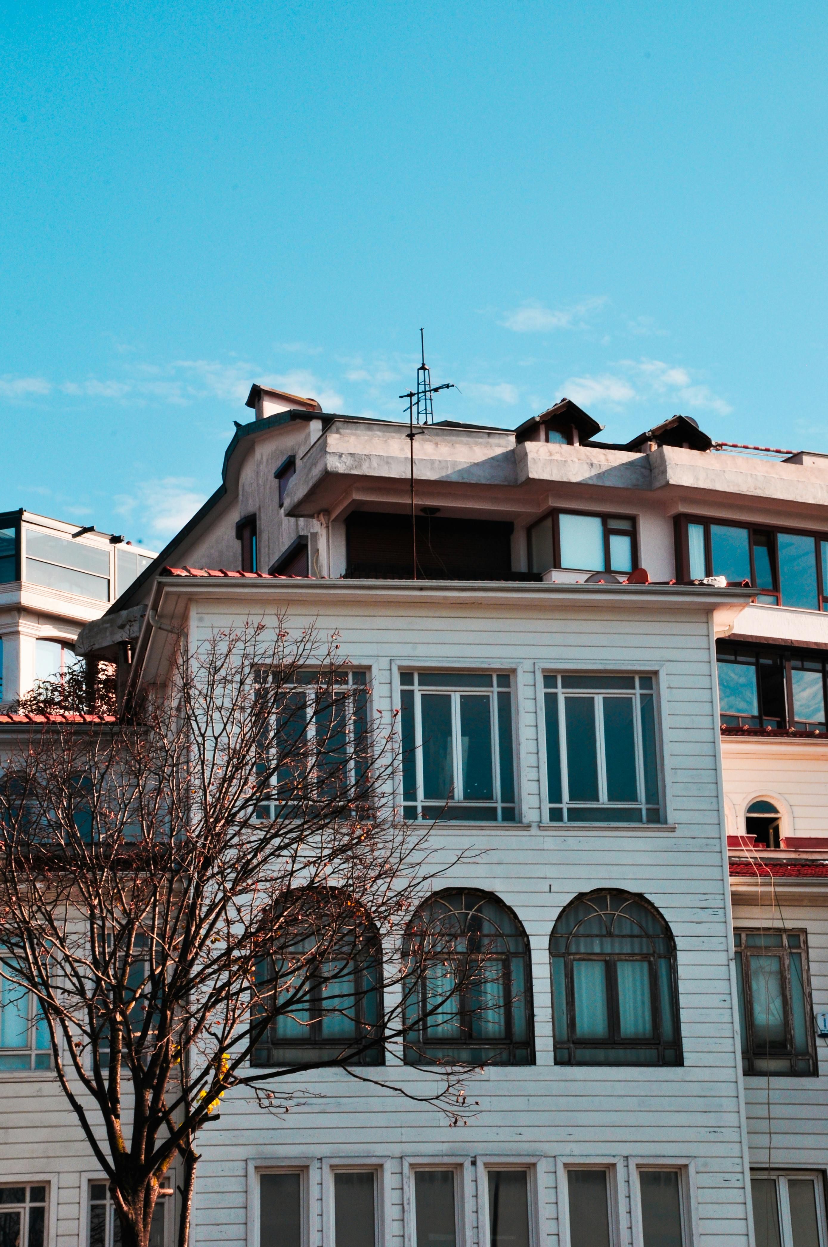 View of a multi-story urban building under a clear blue sky.