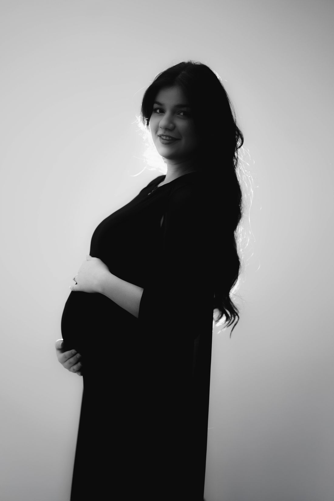Maternity photography — elegant side profile portrait