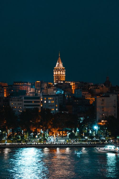 Free Stunning night view of Galata Tower illuminated over the bustling Istanbul skyline. Stock Photo