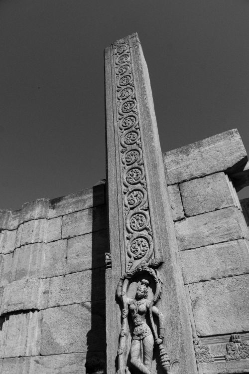Free Black and white photo showcasing detailed stone carvings of a deity at Melukote Temple, Karnataka, India. Stock Photo