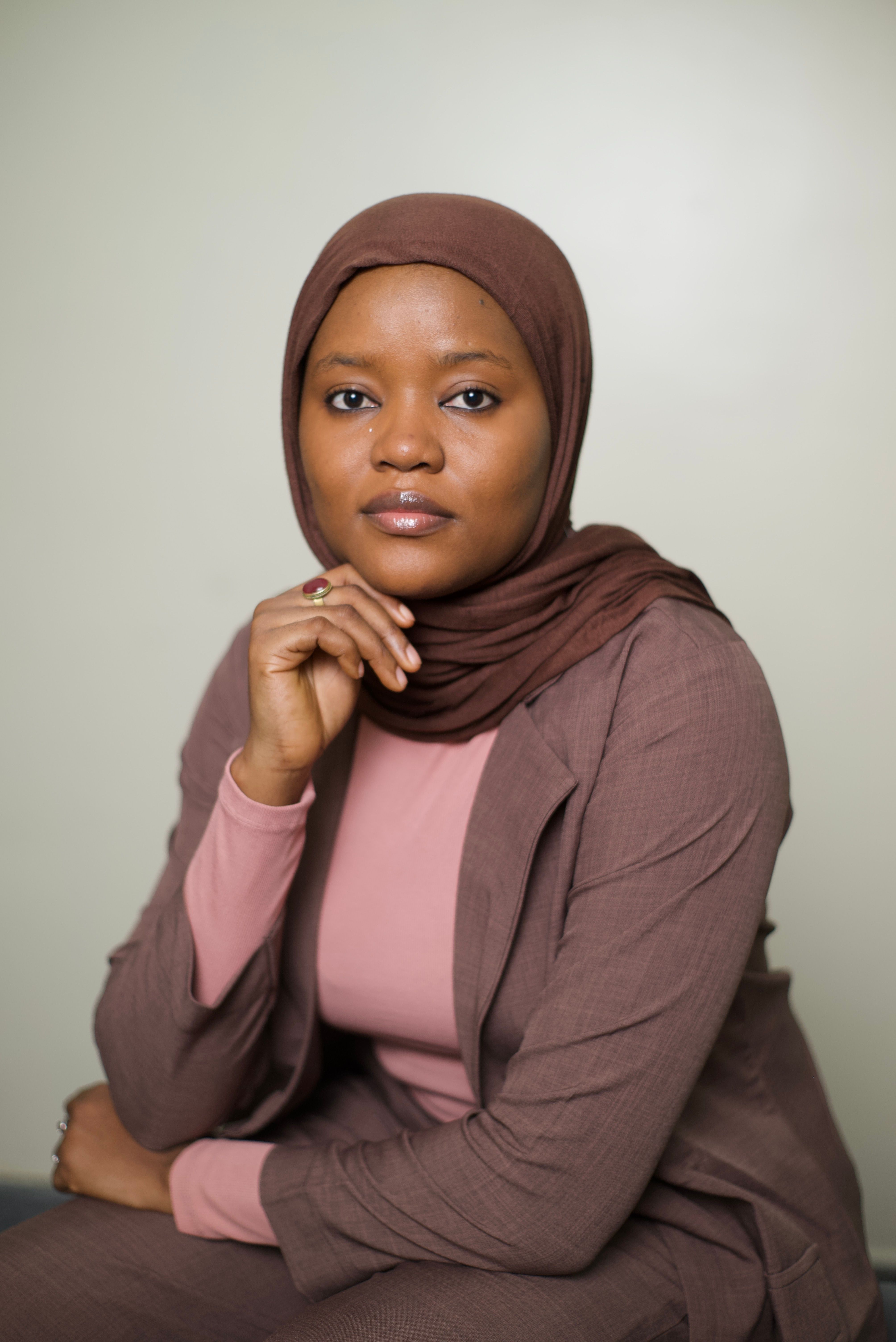 Professional portrait of a confident Muslim businesswoman in hijab, embodying elegance and leadership.
