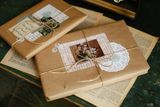 Kraft-paper wrapped gifts, photo by betül nur akyürek on Pexels