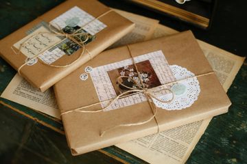 Kraft-paper wrapped parcels, photo by betül nur akyürek on Pexels