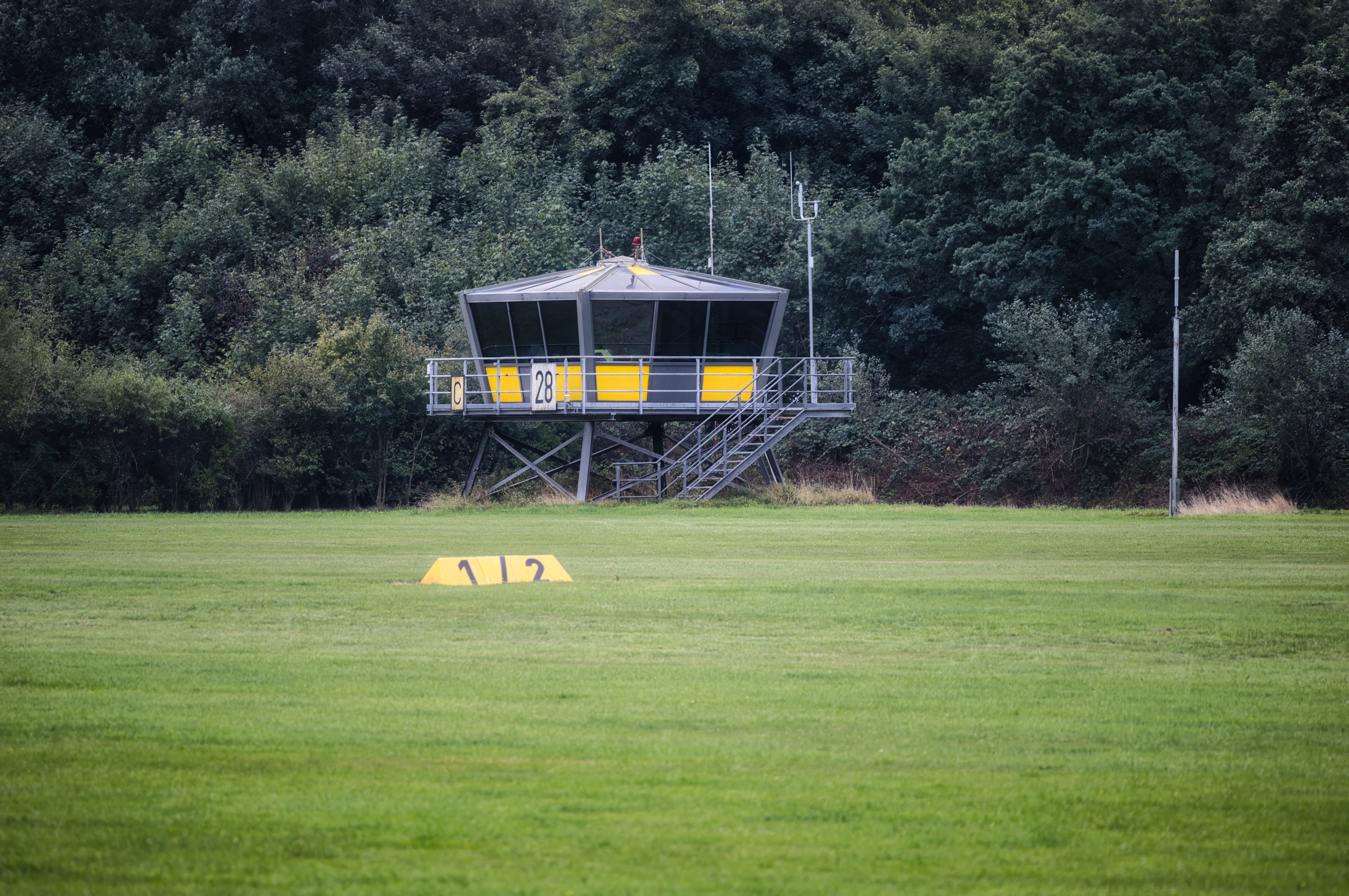 Small Airfield Control Tower in Lush Greenery · Free Stock Photo