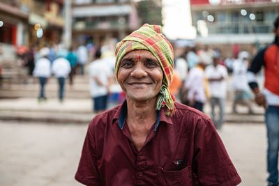 Portrait of a joyful man on a Varanasi street.