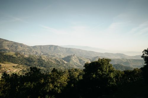 Free Breathtaking view of a vast mountain range under sunny skies, perfect for nature and travel themes. Stock Photo
