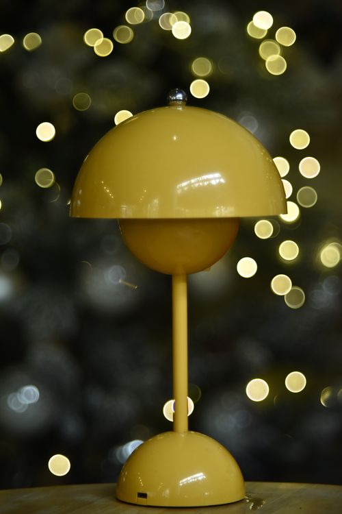 A yellow domed table lamp against soft bokeh, photo by Soc Nang Dong on Pexels