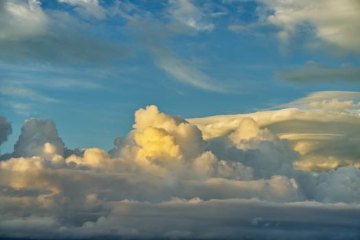 A stunning view of cumulus clouds against a bright blue sky, showcasing nature's beauty.