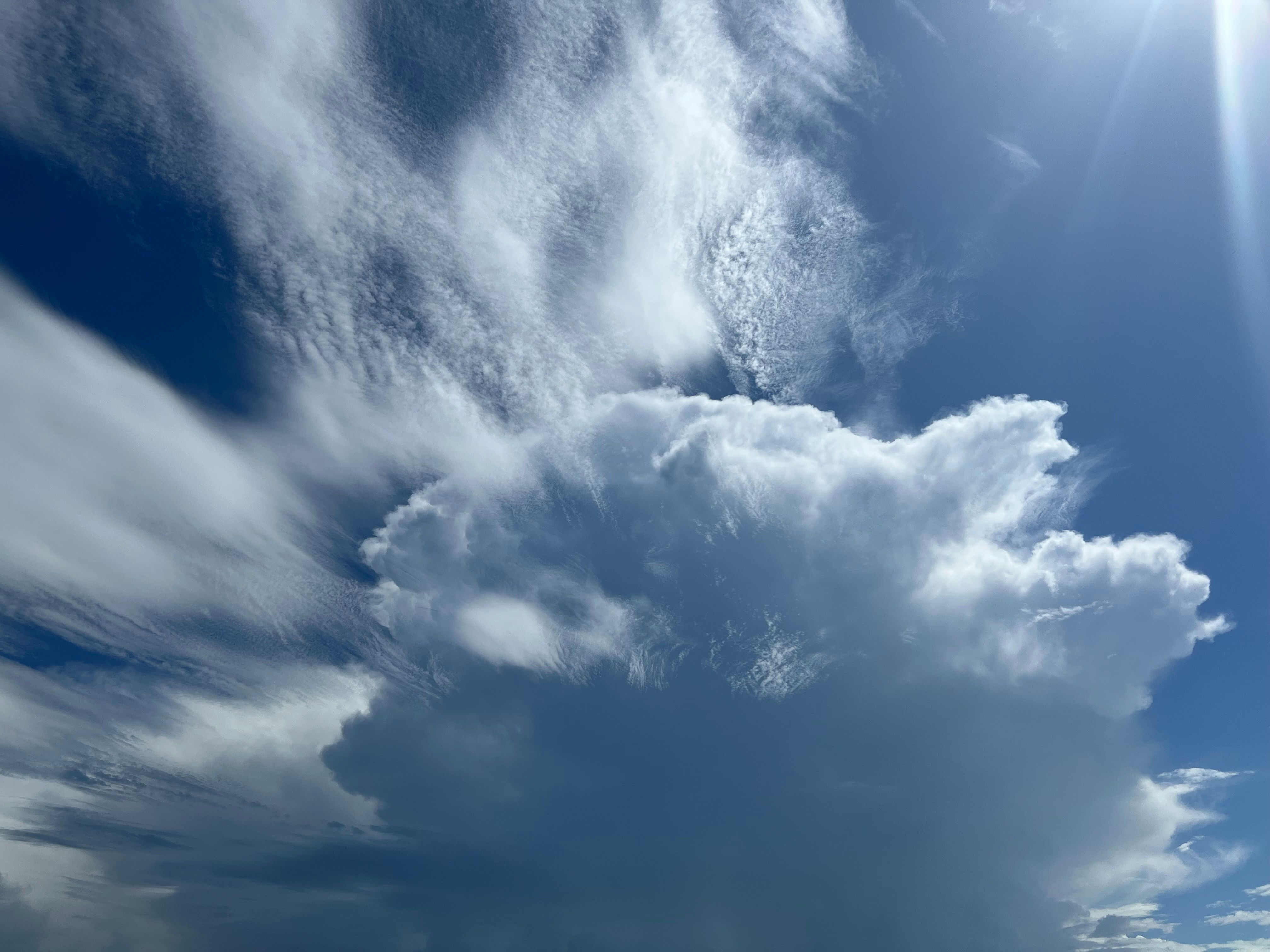 Stunning view of a cumulonimbus cloud formation under a bright summer sky.