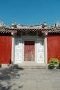 Traditional Chinese Temple Entrance with Red Walls