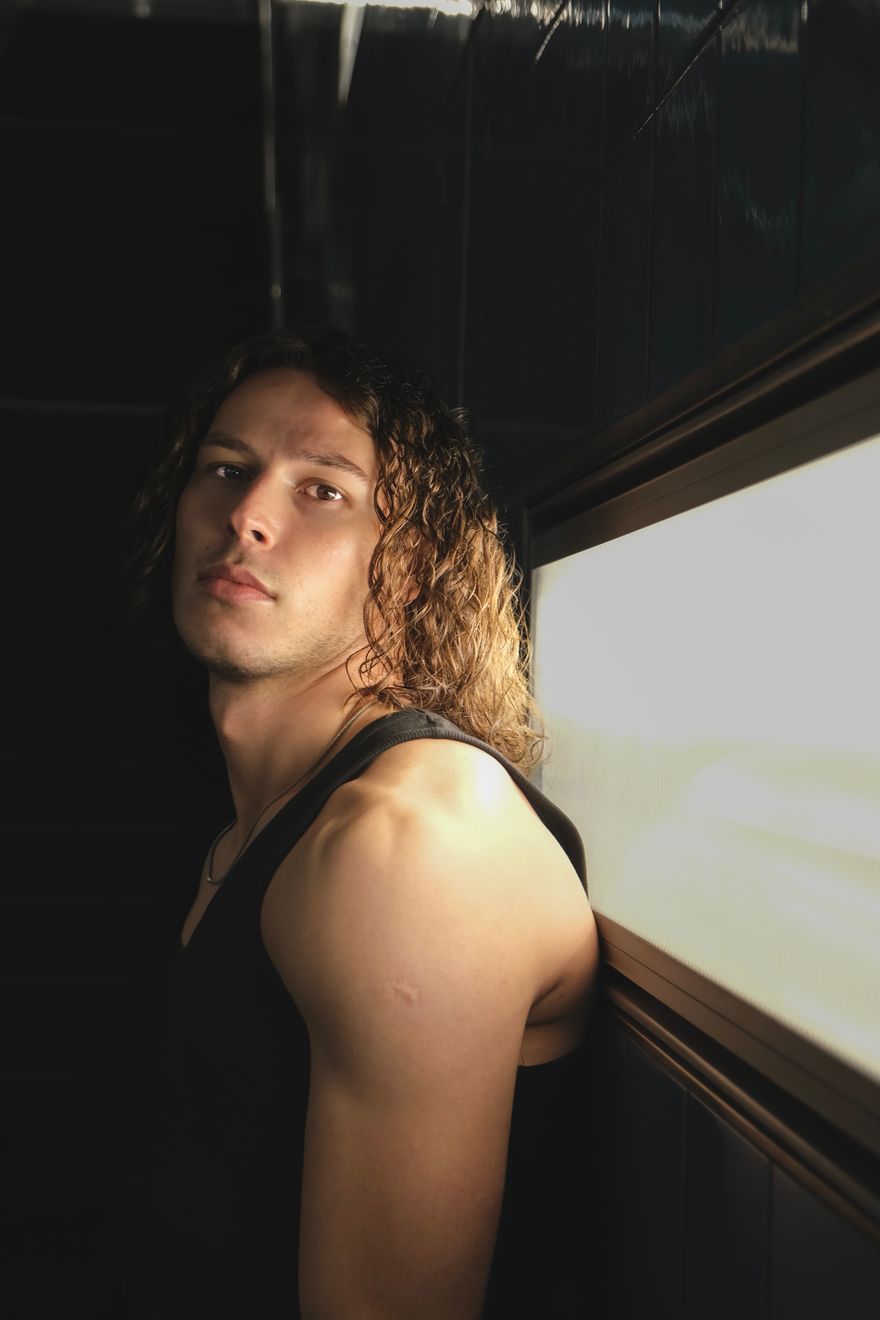 Portrait by a window in soft daylight — Laura Cleffmann on Pexels