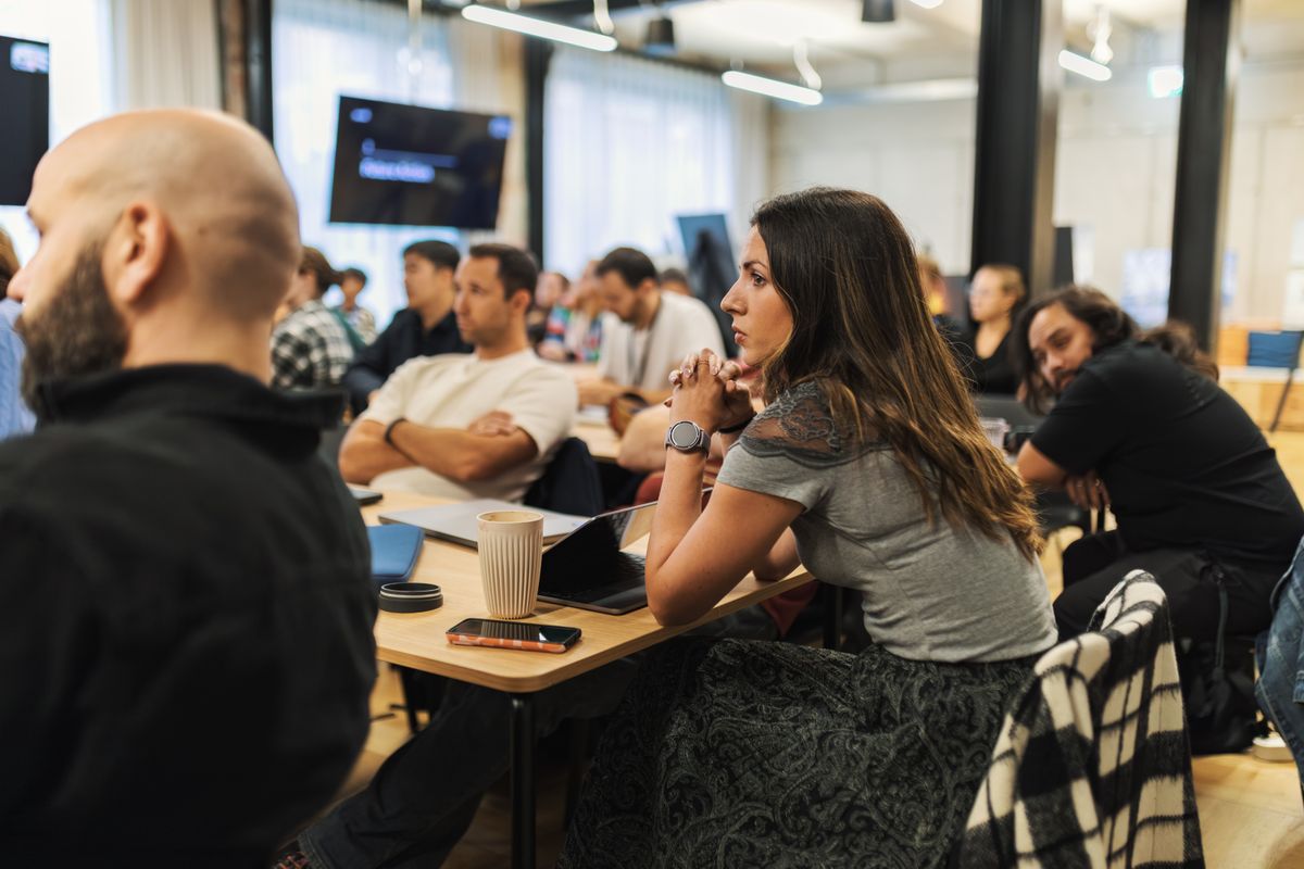 Professionals listening during a strategy session.