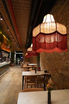 Charming interior of a bar in Santiago de Compostela, featuring stylish chandeliers and rustic decor.