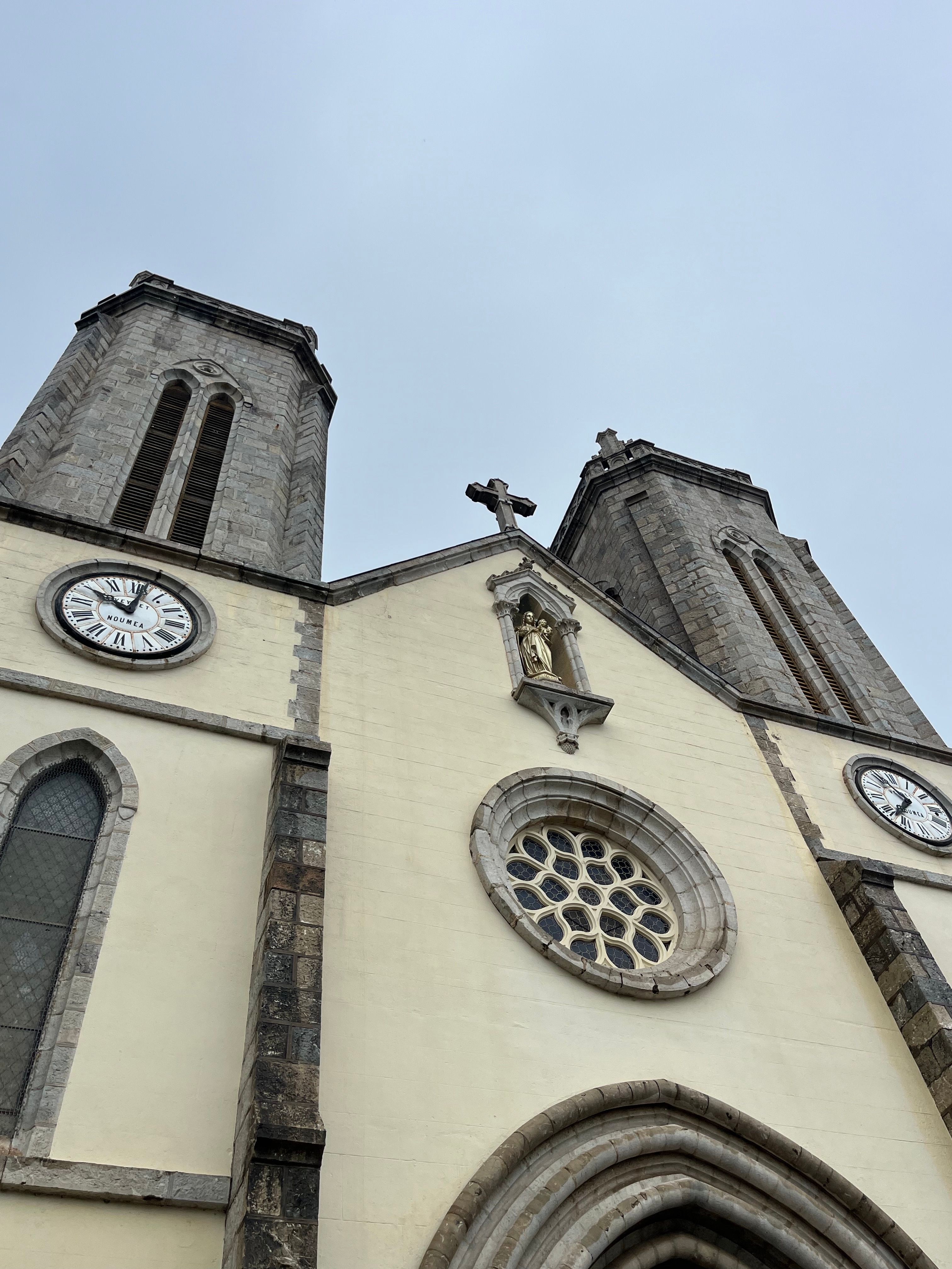 Historic Church Facade with Clock Towers · Free Stock Photo