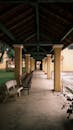 Rustic Covered Walkway with Benches and Columns