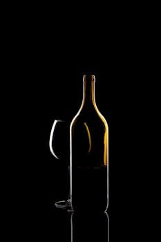 Elegant silhouette of a wine bottle and glass highlighting simple refinement