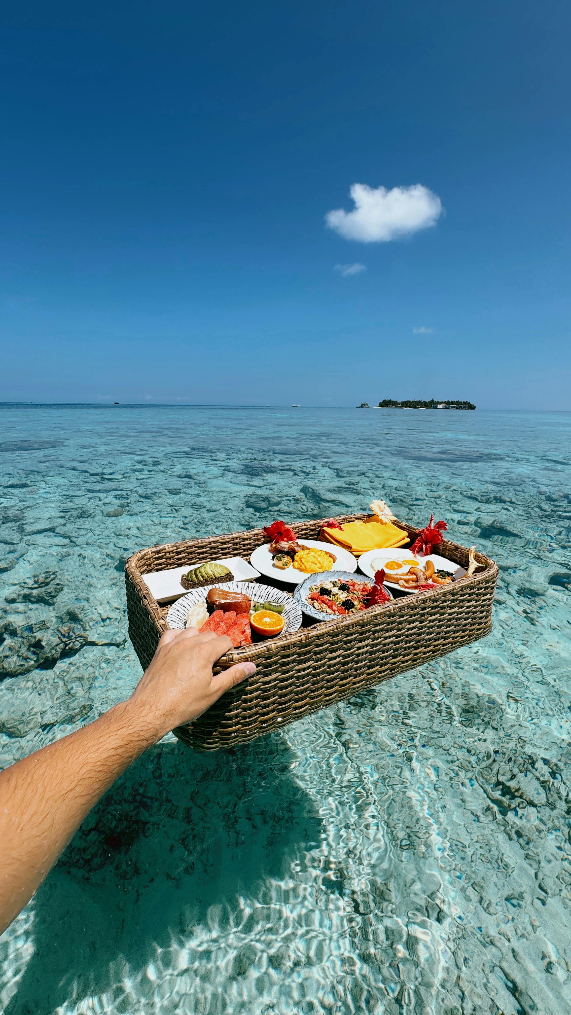 Free Enjoy a tropical breakfast served on crystal clear waters in the Maldives. Stock Photo