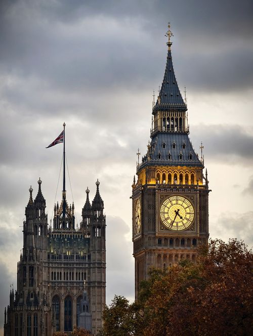 Free Iconic Big Ben clock tower and Houses of Parliament in London against a dramatic sky. Stock Photo