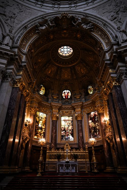 Free Stunning view of an ornate cathedral interior with stained glass windows. Stock Photo