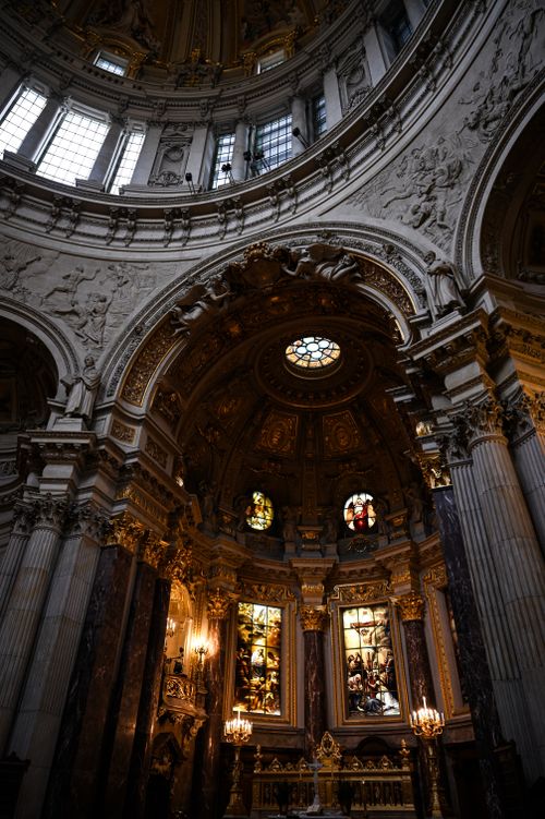 Free Stunning view of an ornate cathedral interior with stained glass and decorative architecture. Stock Photo